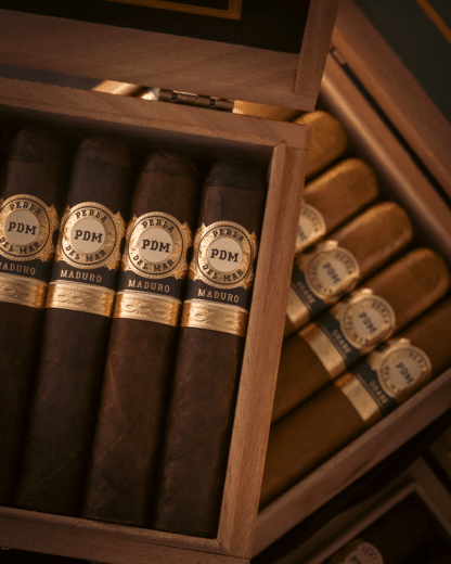 Stacked open boxes of Perla del Mar Maduro and Shade